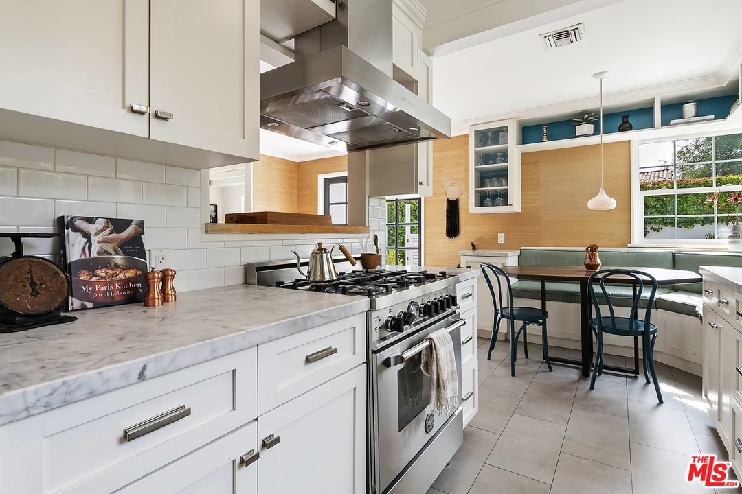 2801 West Silver Drive Los Angeles, CA 90039 - Photo 10 of 34 a kitchen with stainless steel appliances granite countertop a stove a sink and a microwave