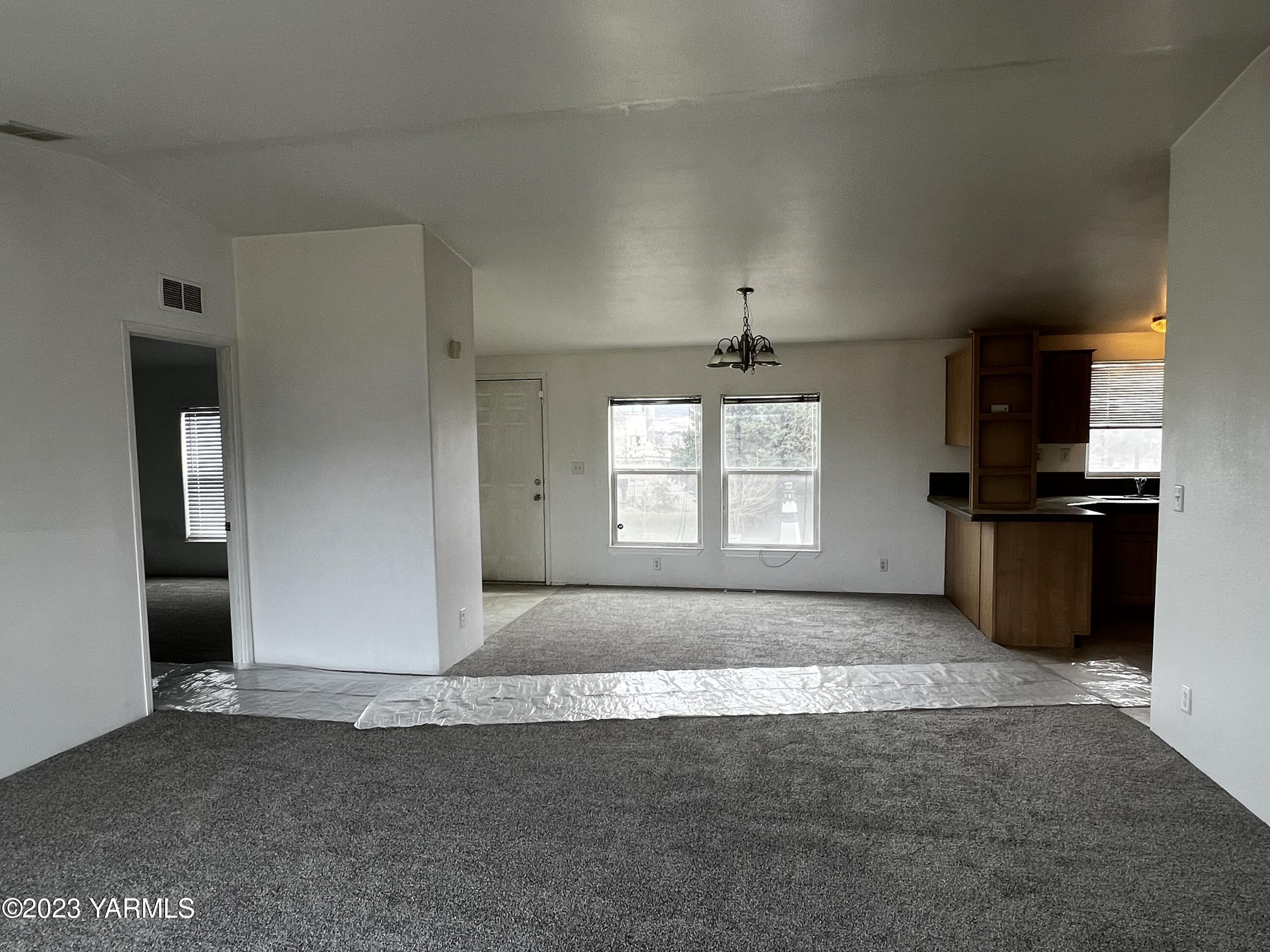 12102 North Hinzerling Road Prosser, WA 99350 - Photo 15 of 43 an empty room with windows and stainless steel appliances