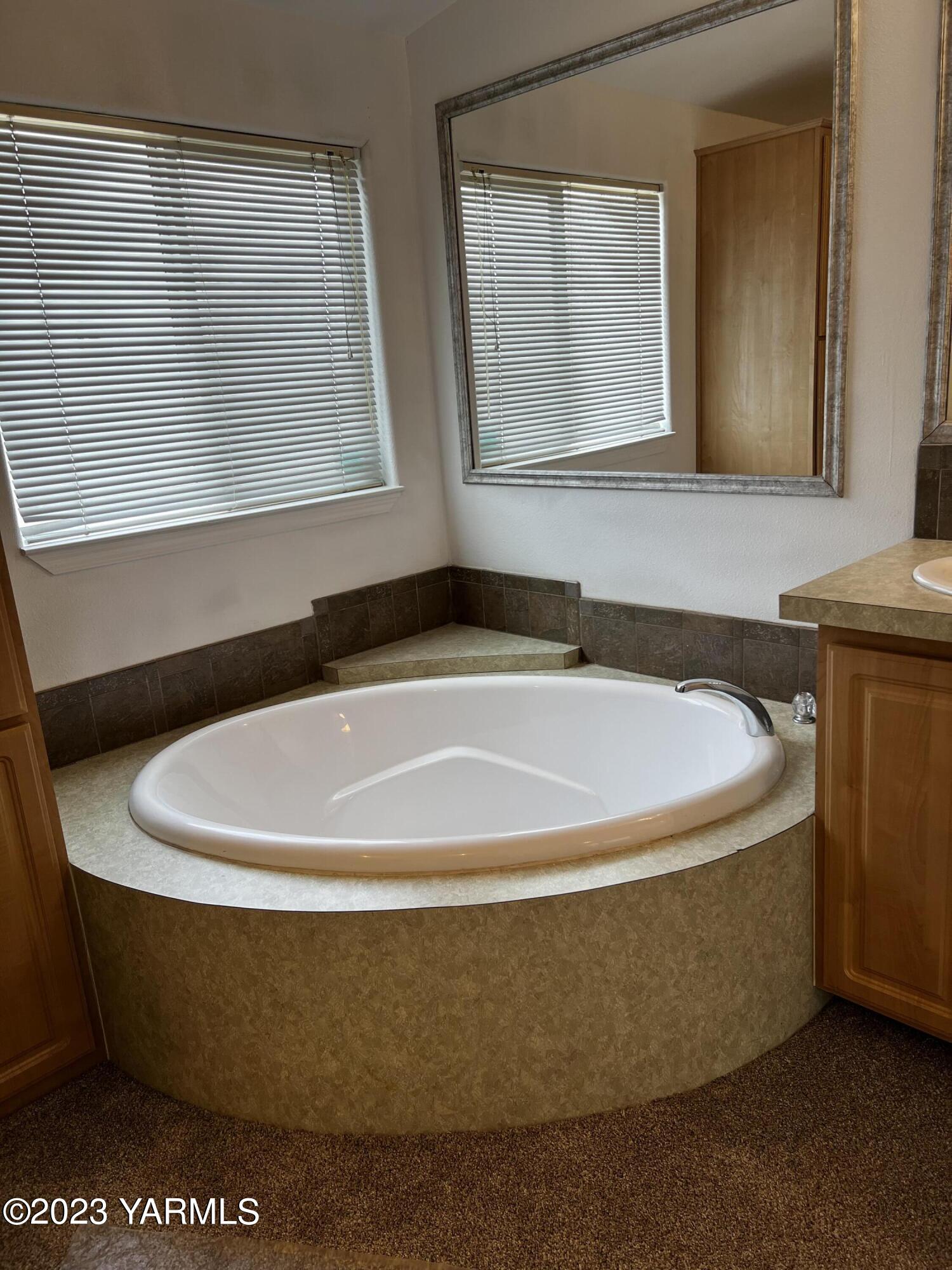 12102 North Hinzerling Road Prosser, WA 99350 - Photo 8 of 43 a white bath tub sitting in a bathroom