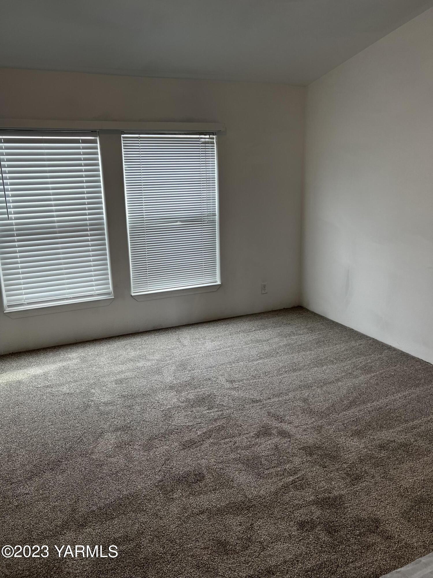 12102 North Hinzerling Road Prosser, WA 99350 - Photo 9 of 43 a view of an empty room with a window