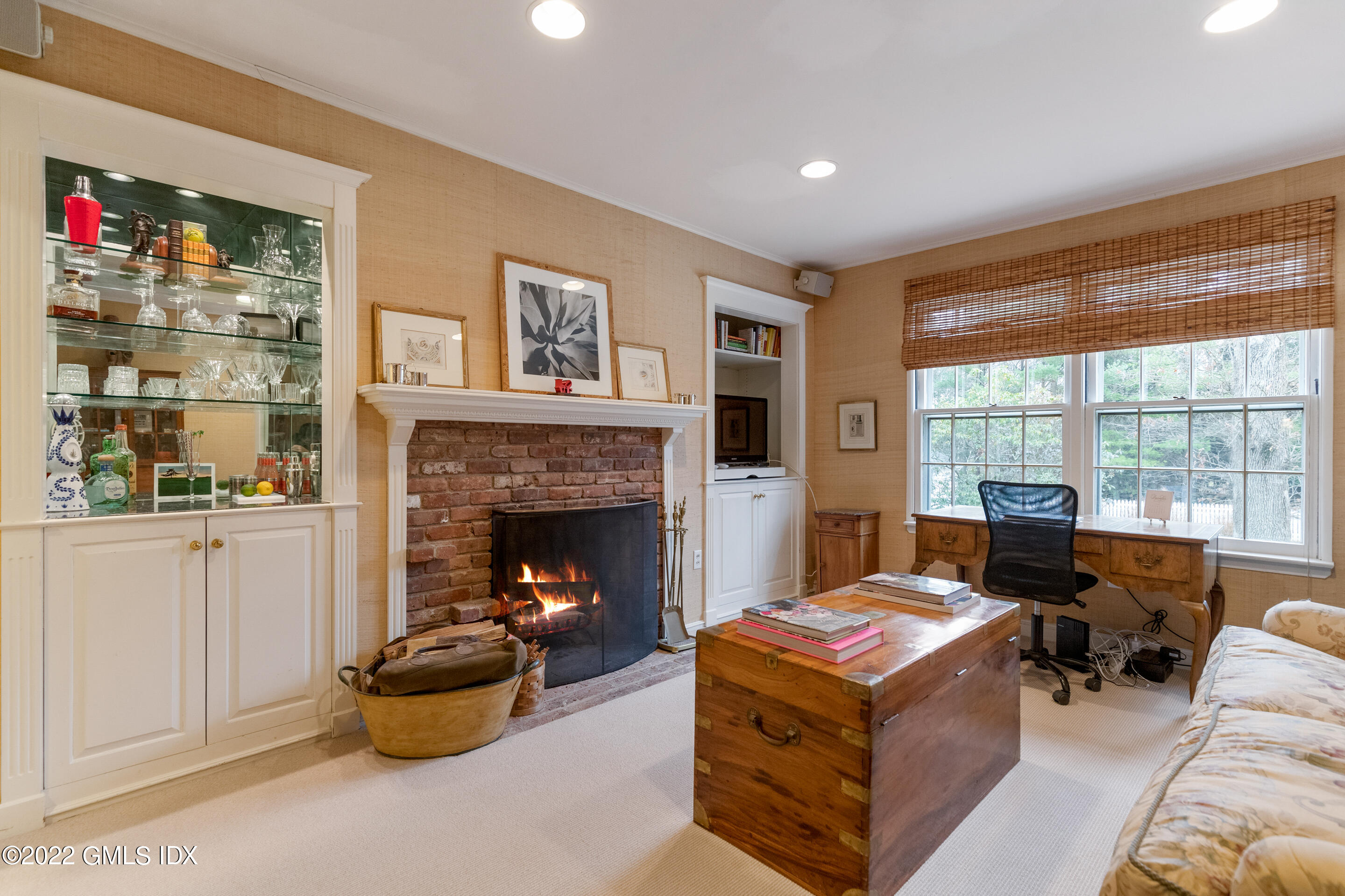32 Alpine Road Greenwich, CT 06830 - Photo 13 of 17 a living room with furniture a fireplace and a large window