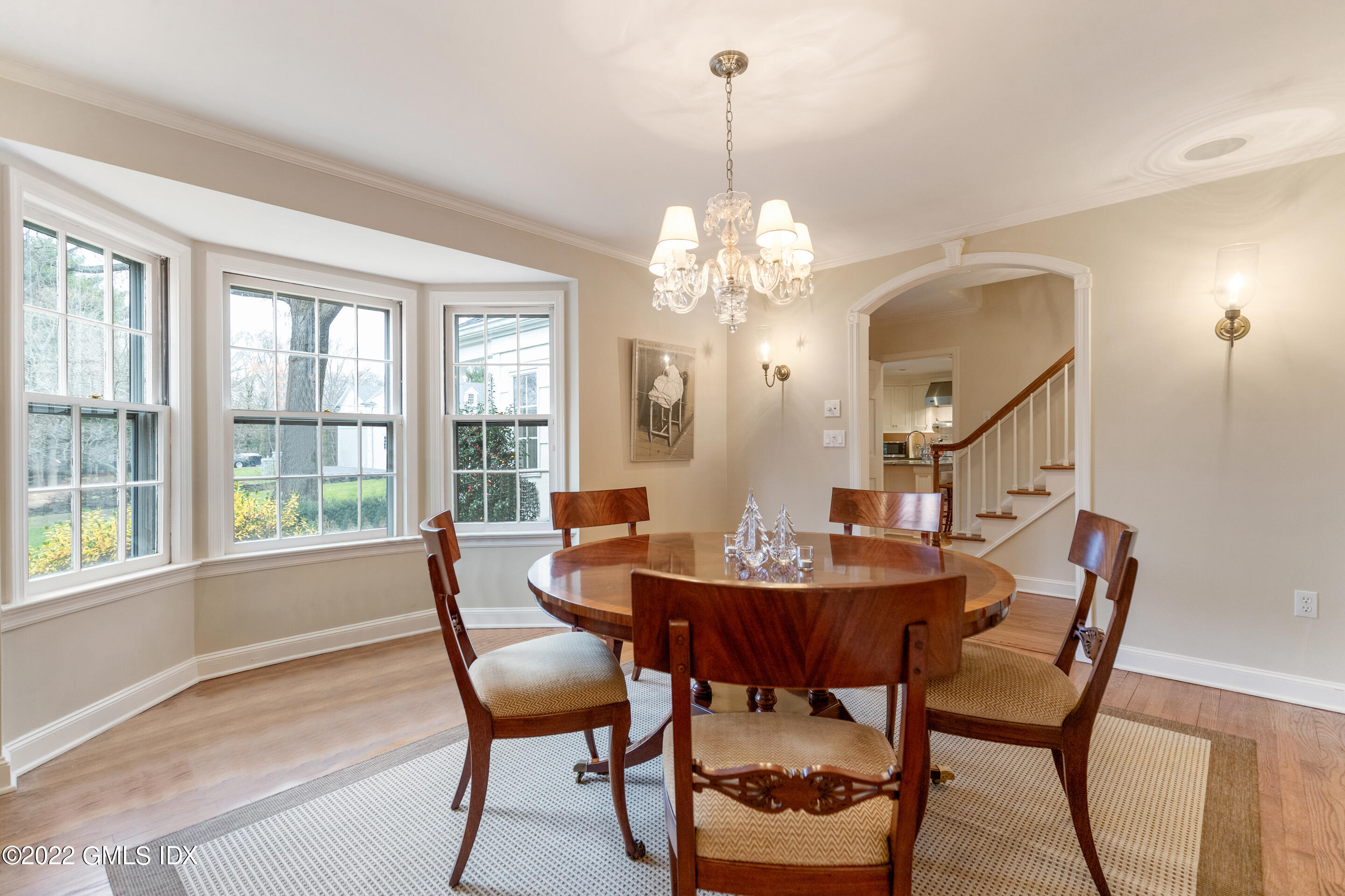 32 Alpine Road Greenwich, CT 06830 - Photo 4 of 17 a dining room with furniture a chandelier and wooden floor