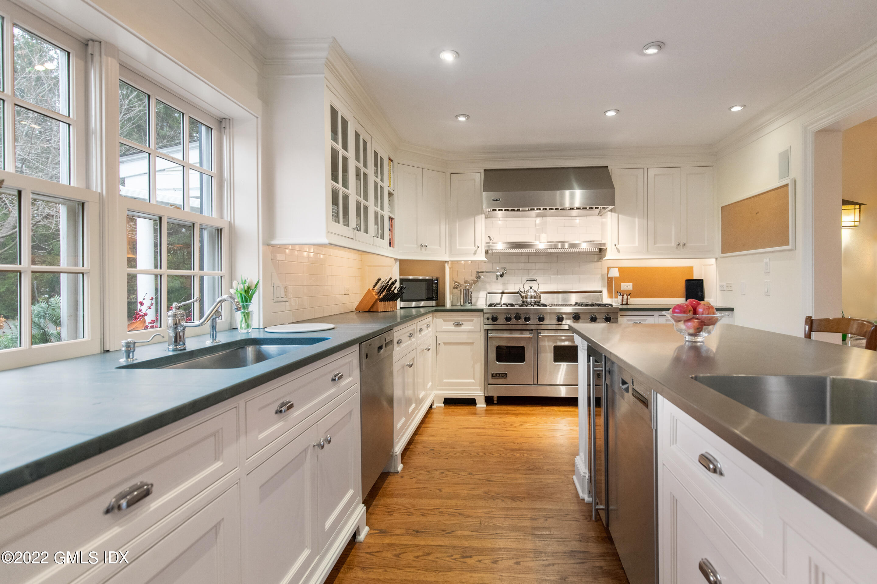 32 Alpine Road Greenwich, CT 06830 - Photo 10 of 17 a kitchen with stainless steel appliances granite countertop a sink and window