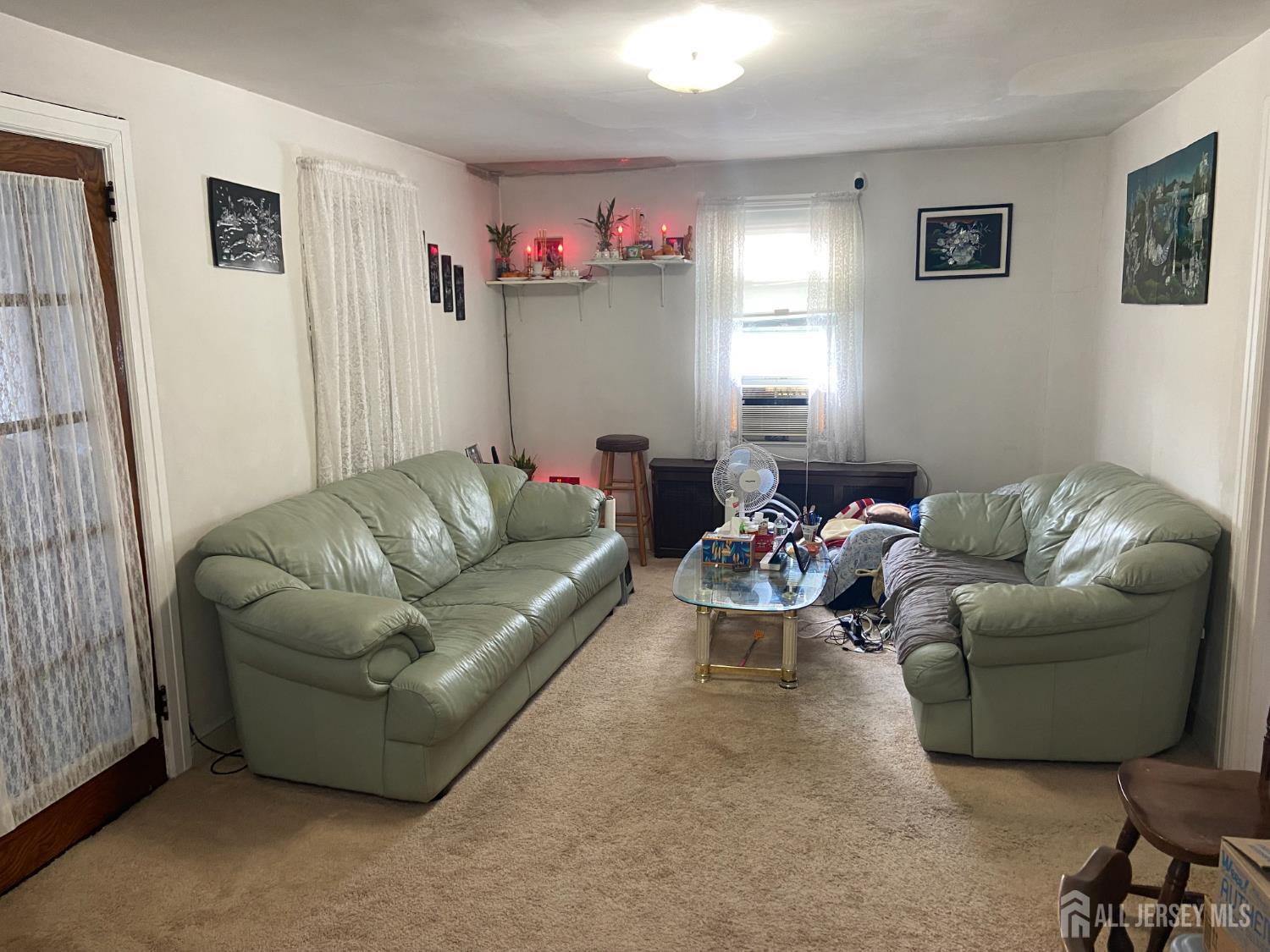 739 Ridgedale Avenue Woodbridge, NJ 07095 - Photo 3 of 10 a living room with furniture and a window