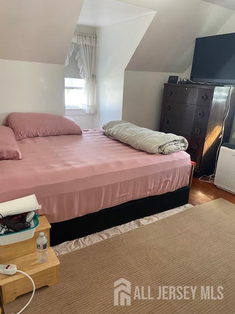 739 Ridgedale Avenue Woodbridge, NJ 07095 - Photo 7 of 10 a bedroom with bed and window