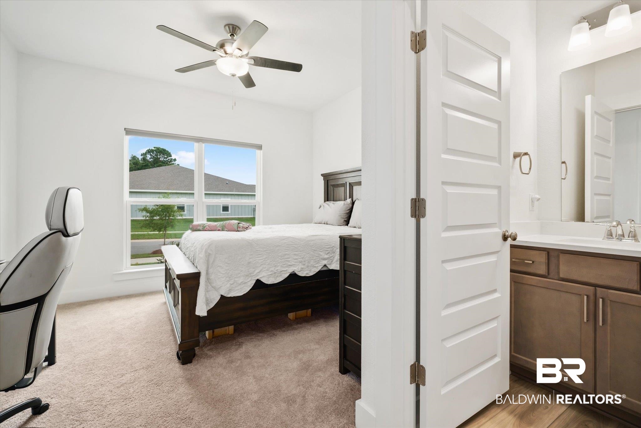 263 Bronze Street Fairhope, AL 36532 - Photo 24 of 47 Bedroom featuring ceiling fan, sink, and light carpet