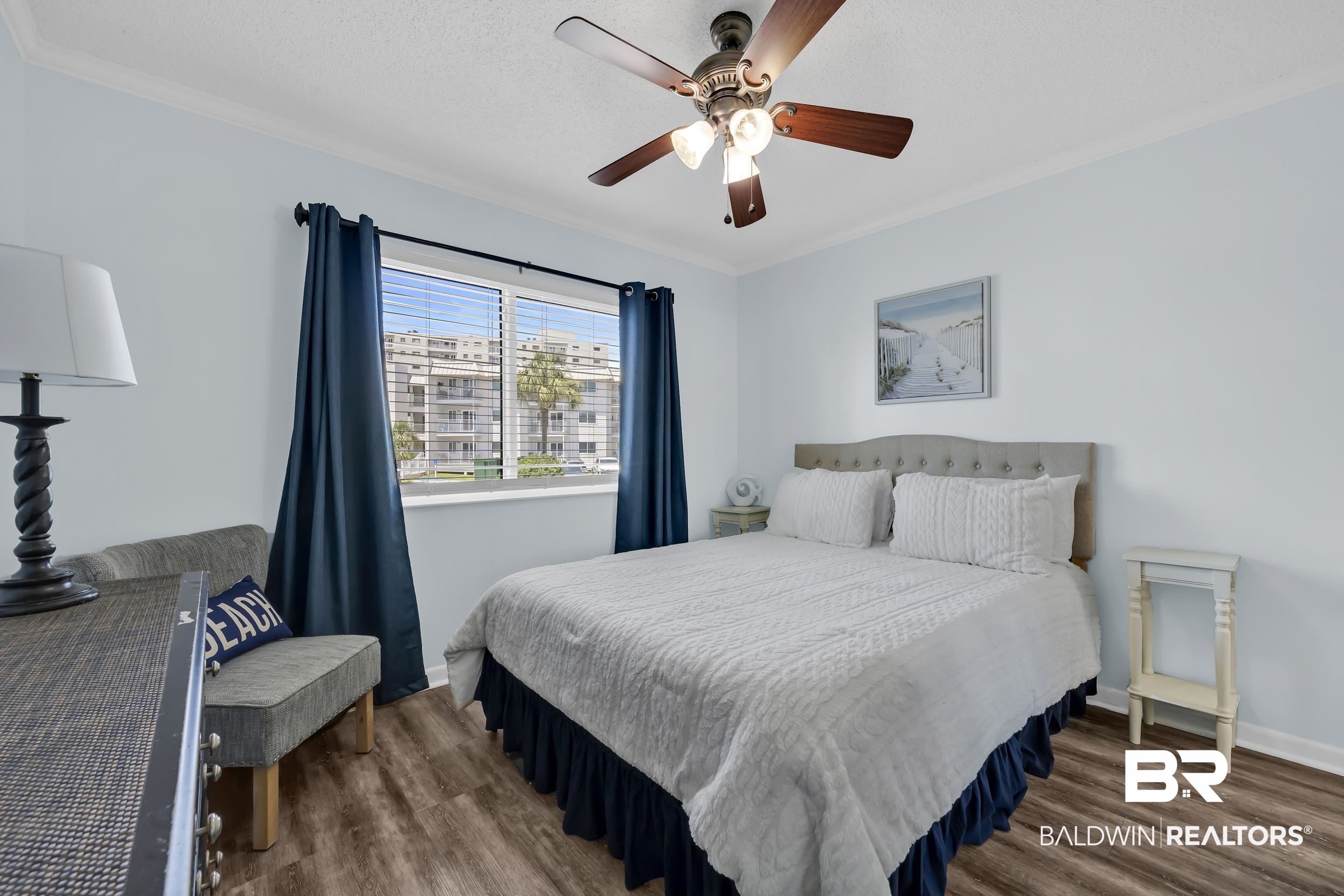 400 Plantation Road, Unit 2118 Gulf Shores, AL 36542 - Photo 14 of 59 Recessed window featuring horizontal blinds and dark blue drapery