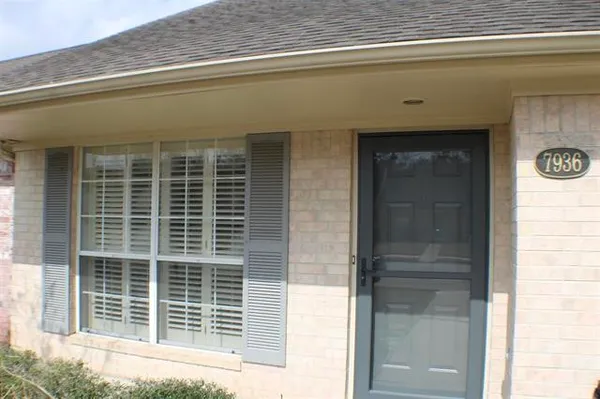a front view of a house with a large window