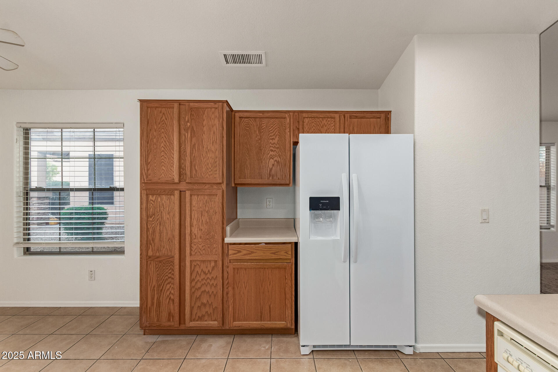 17573 West Dalea Drive Goodyear, AZ 85338 - Photo 11 of 29 a kitchen with stainless steel appliances a refrigerator and cabinets