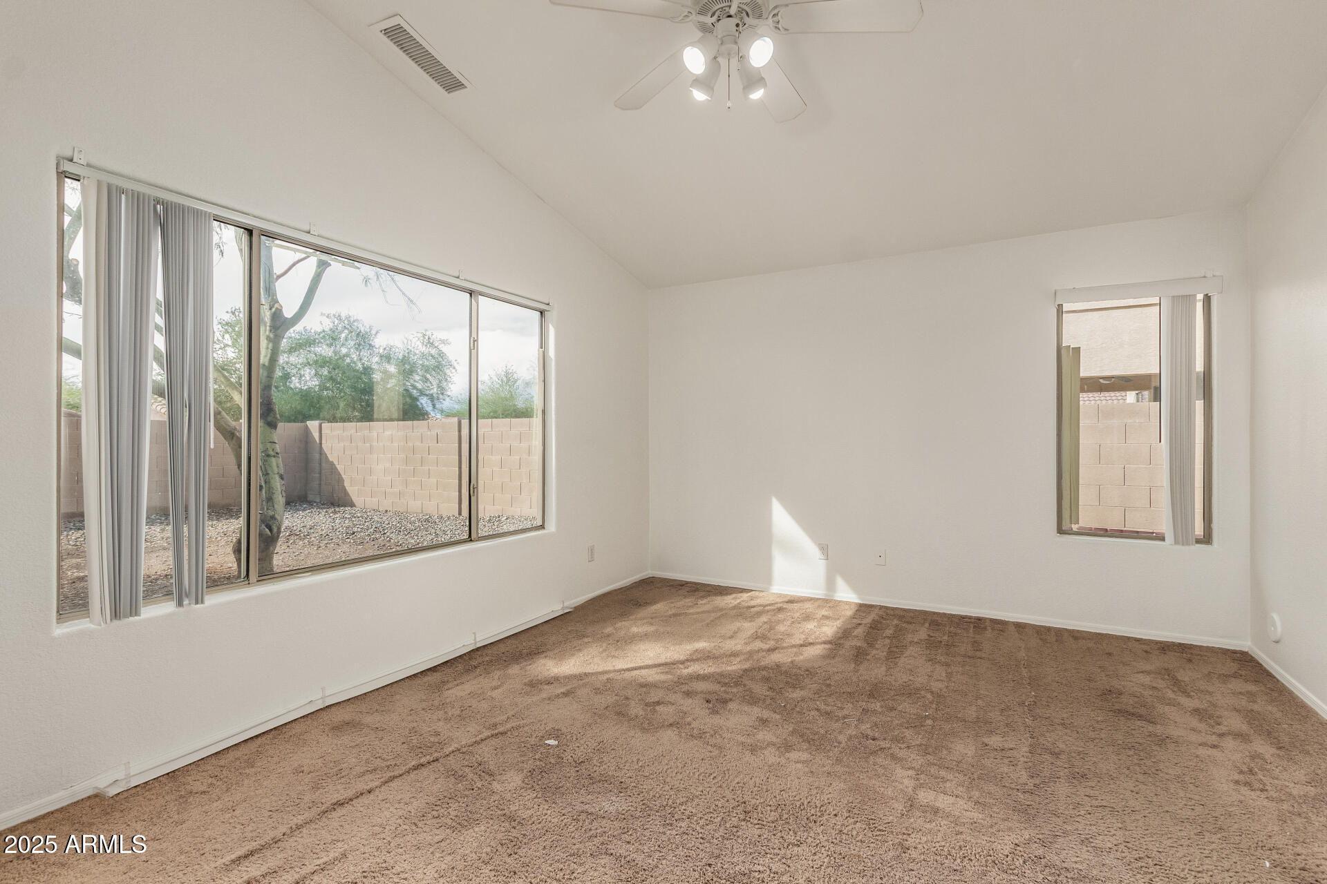 17573 West Dalea Drive Goodyear, AZ 85338 - Photo 14 of 29 wooden floor in an empty room with a window
