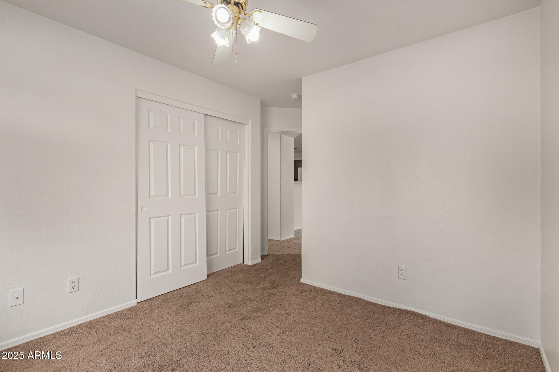17573 West Dalea Drive Goodyear, AZ 85338 - Photo 21 of 29 an empty room with a ceiling fan