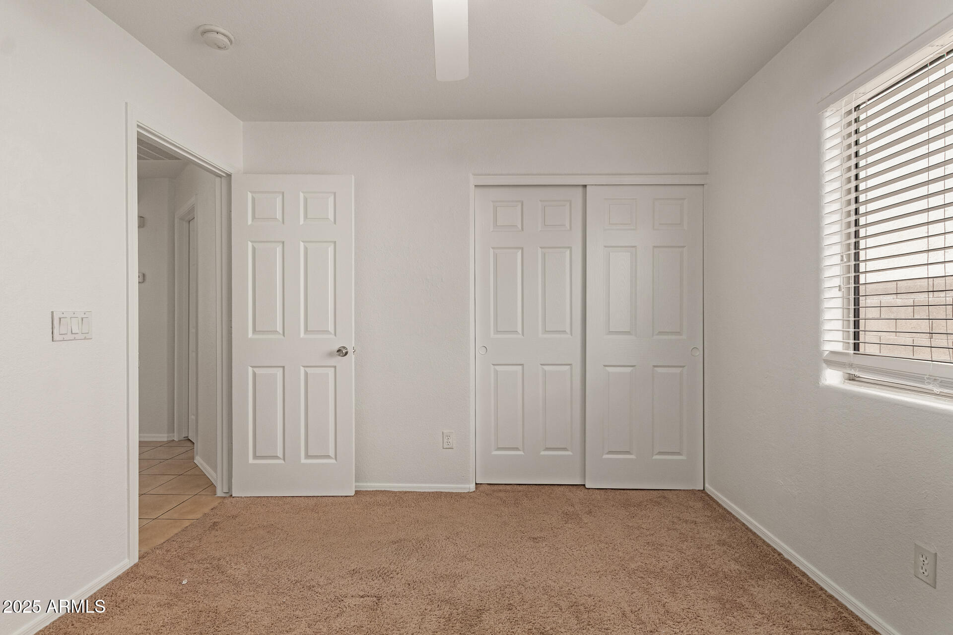 17573 West Dalea Drive Goodyear, AZ 85338 - Photo 23 of 29 an empty room with windows
