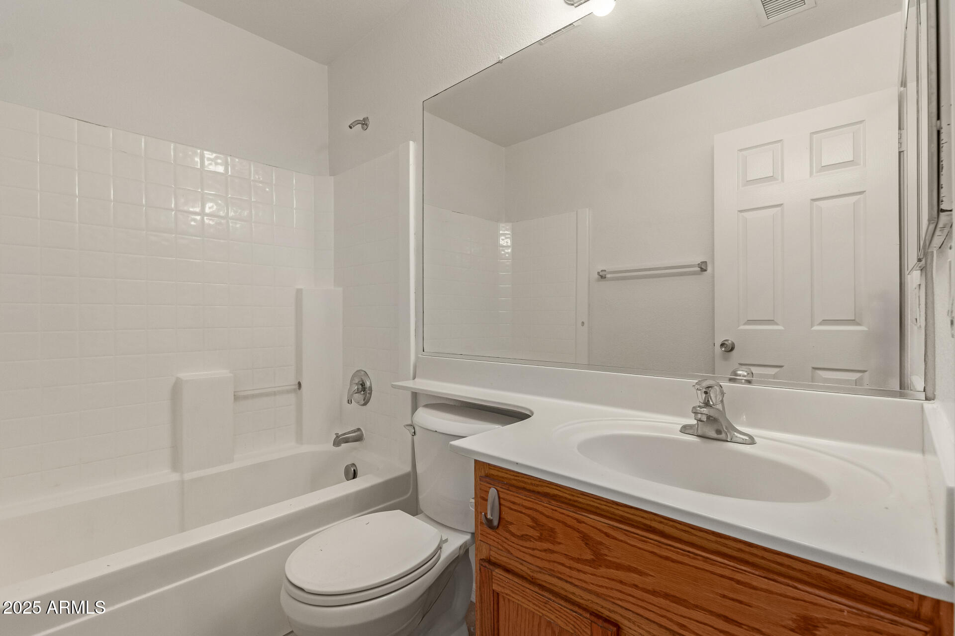 17573 West Dalea Drive Goodyear, AZ 85338 - Photo 24 of 29 a bathroom with a sink toilet a mirror and shower