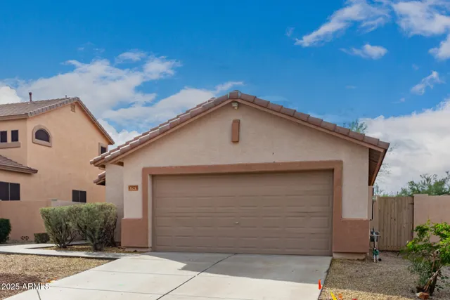 a front view of a house with a garage