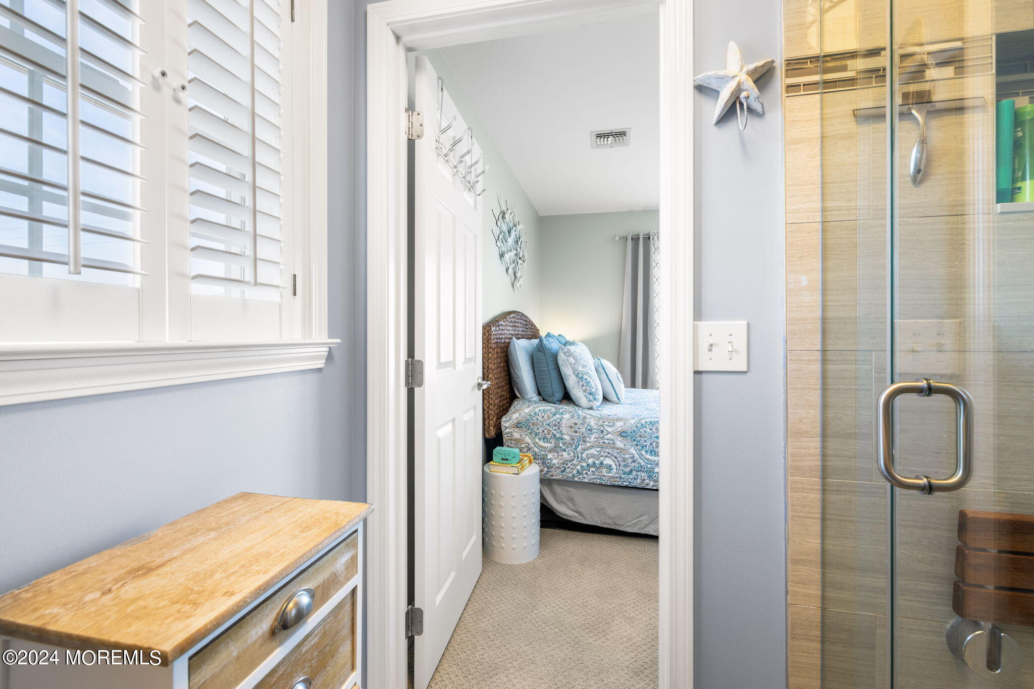 61 Rona Lane Beach Haven West, NJ 08050 - Photo 14 of 63 a en suite bathroom with a sink and a mirror