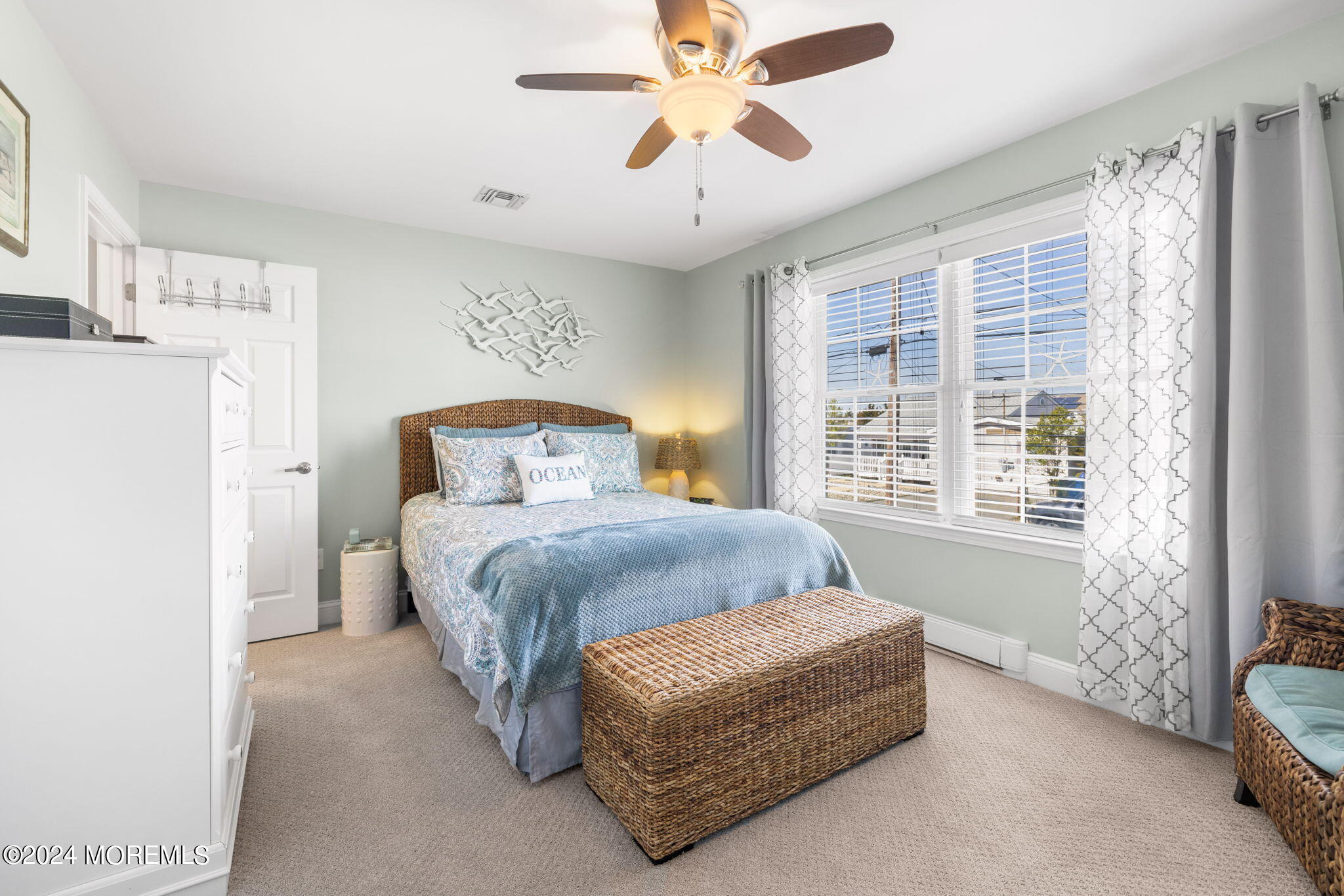 61 Rona Lane Beach Haven West, NJ 08050 - Photo 15 of 63 a bedroom with a bed and a chandelier fan
