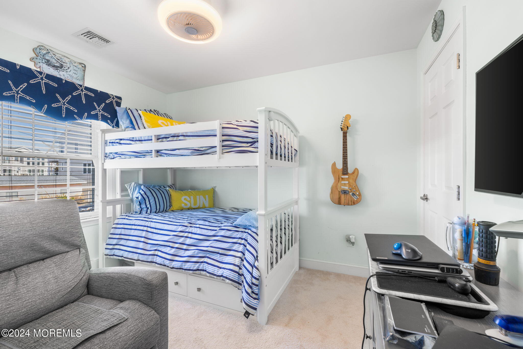 61 Rona Lane Beach Haven West, NJ 08050 - Photo 19 of 63 a bedroom with a bed and a flat screen tv