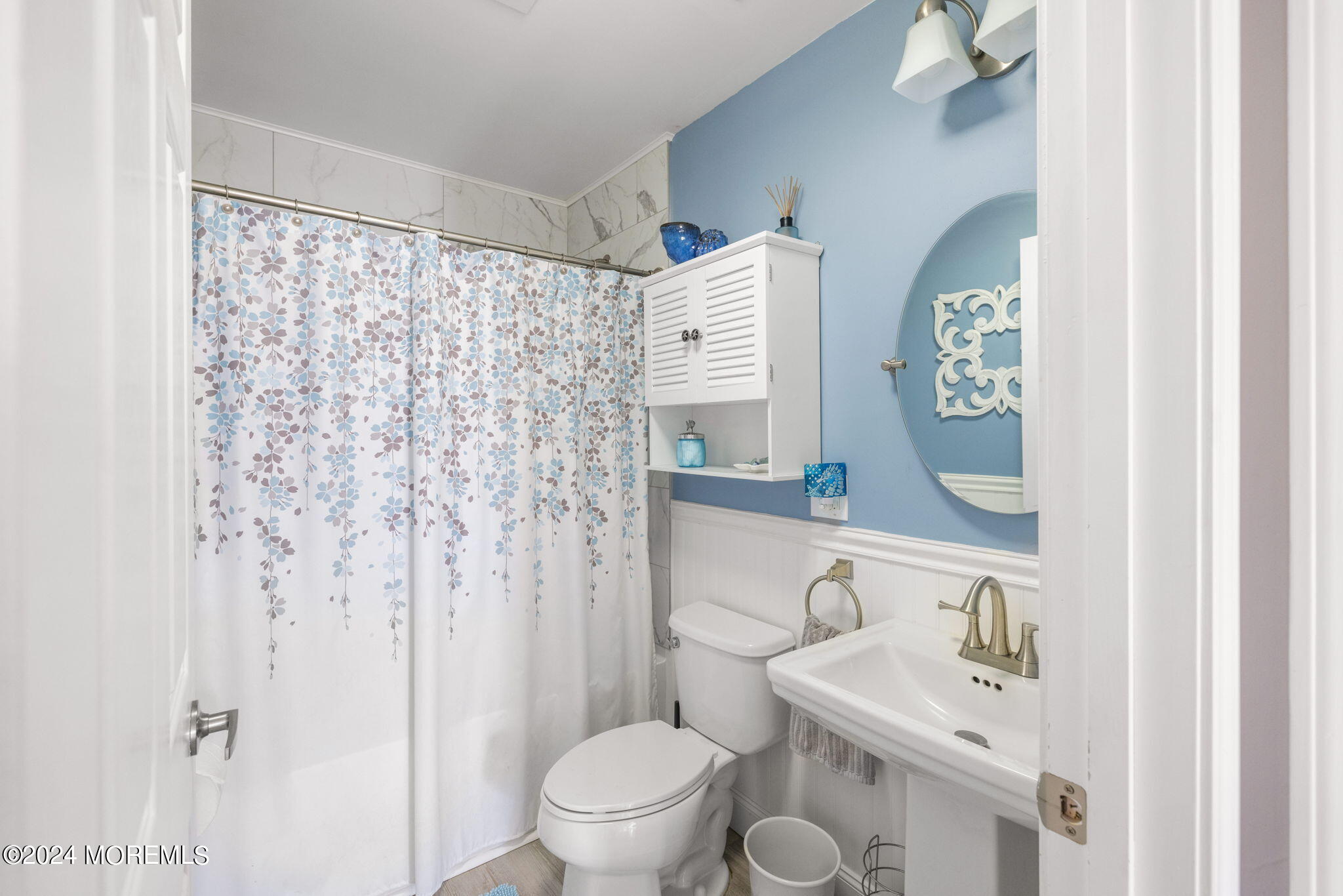 61 Rona Lane Beach Haven West, NJ 08050 - Photo 21 of 63 a bathroom with a sink a toilet and shower curtain