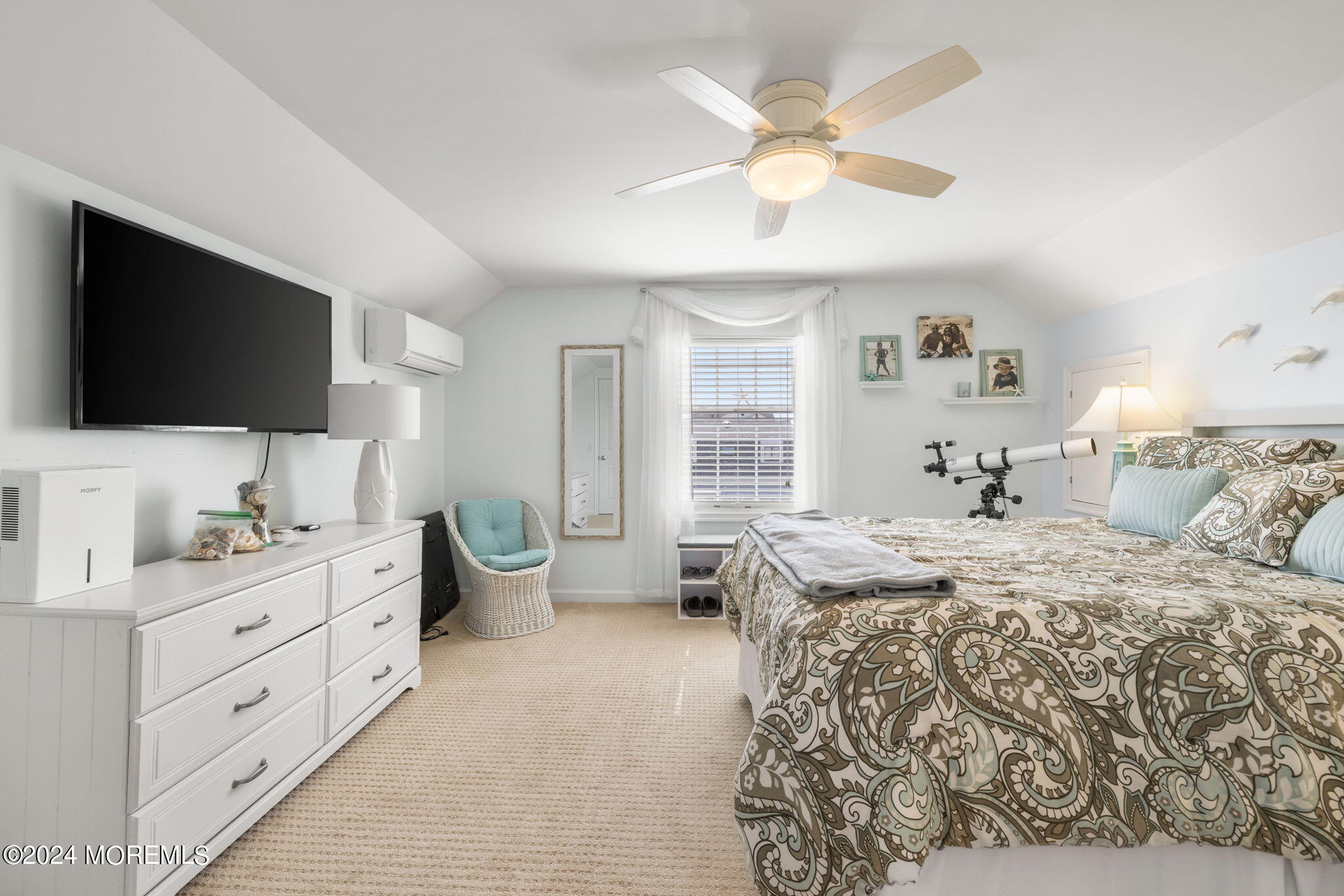 61 Rona Lane Beach Haven West, NJ 08050 - Photo 24 of 63 a bedroom with a bed and a flat screen tv