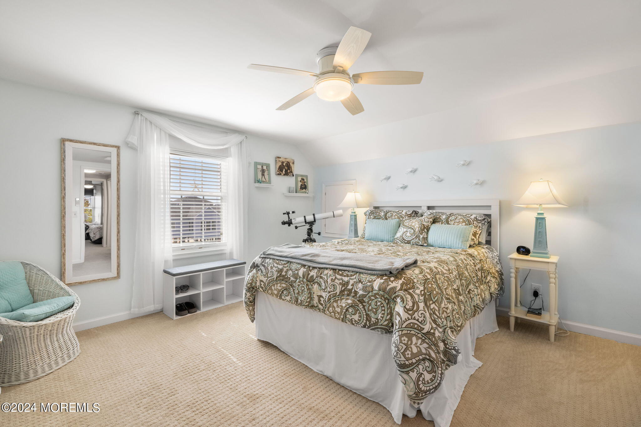 61 Rona Lane Beach Haven West, NJ 08050 - Photo 25 of 63 a bedroom with a bed and a chandelier