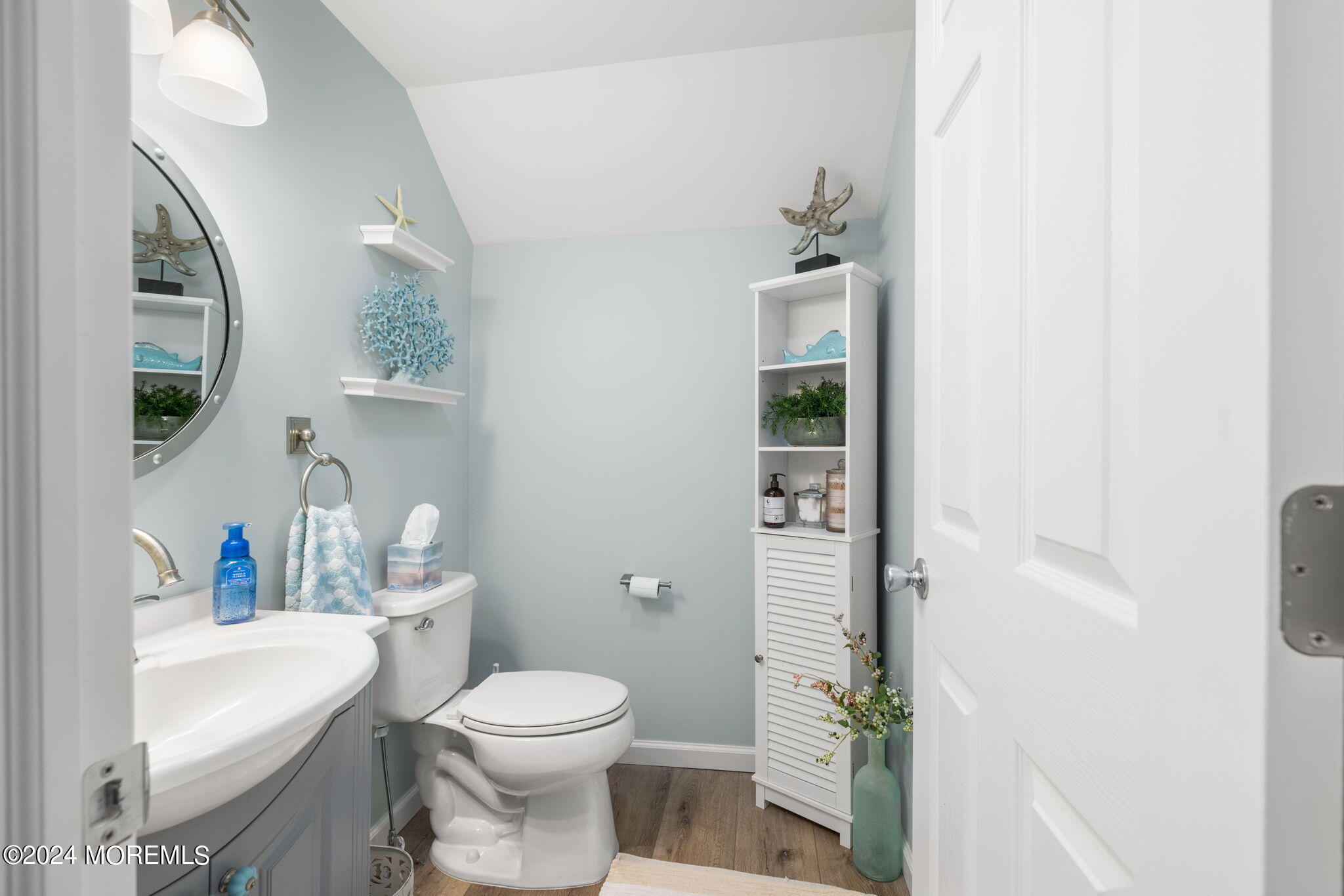 61 Rona Lane Beach Haven West, NJ 08050 - Photo 30 of 63 a white toilet sitting next to a bathroom sink