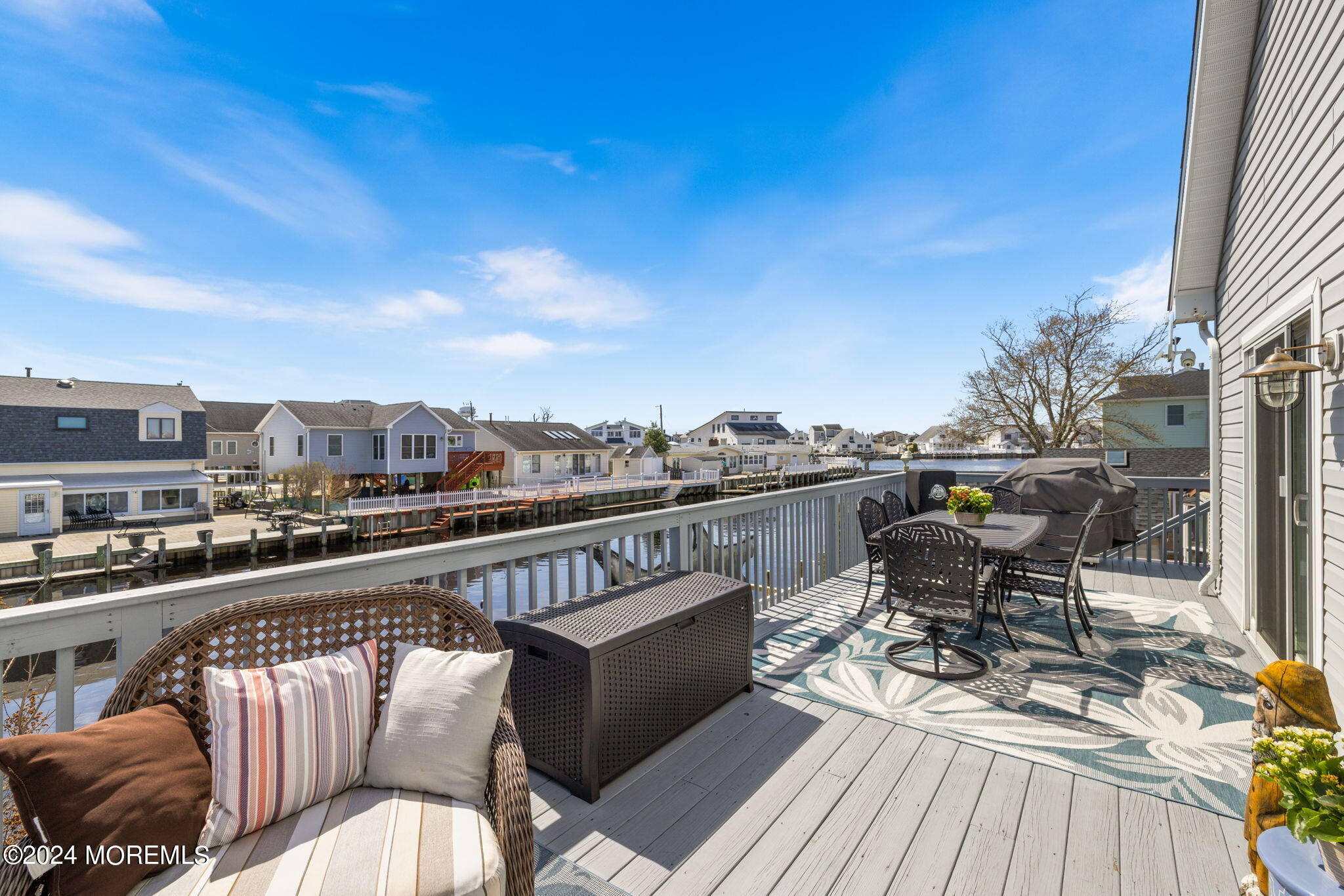 61 Rona Lane Beach Haven West, NJ 08050 - Photo 45 of 63 a balcony with wooden floor outdoor seating and city view