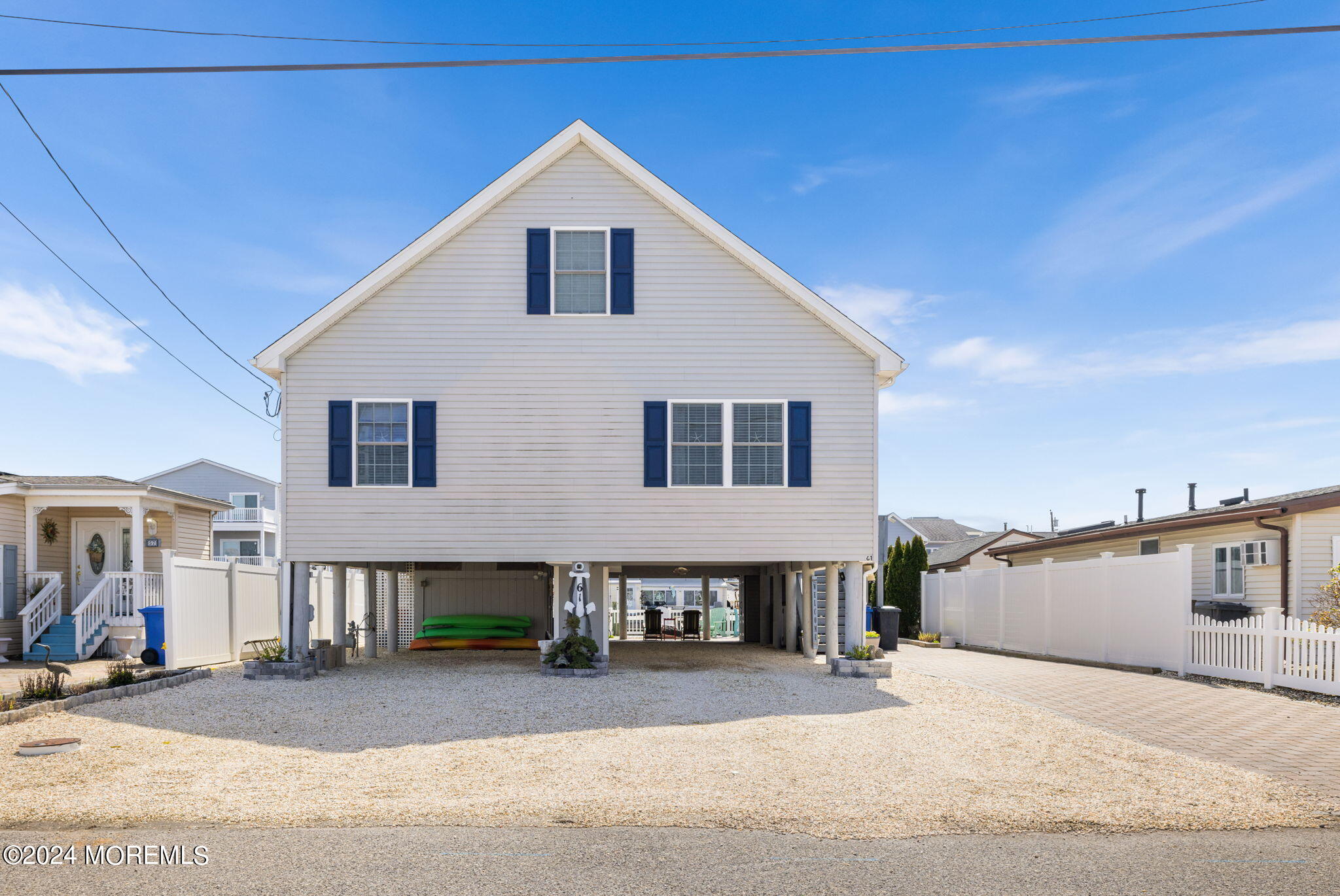 61 Rona Lane Beach Haven West, NJ 08050 - Photo 50 of 63 a front view of a house with a garage