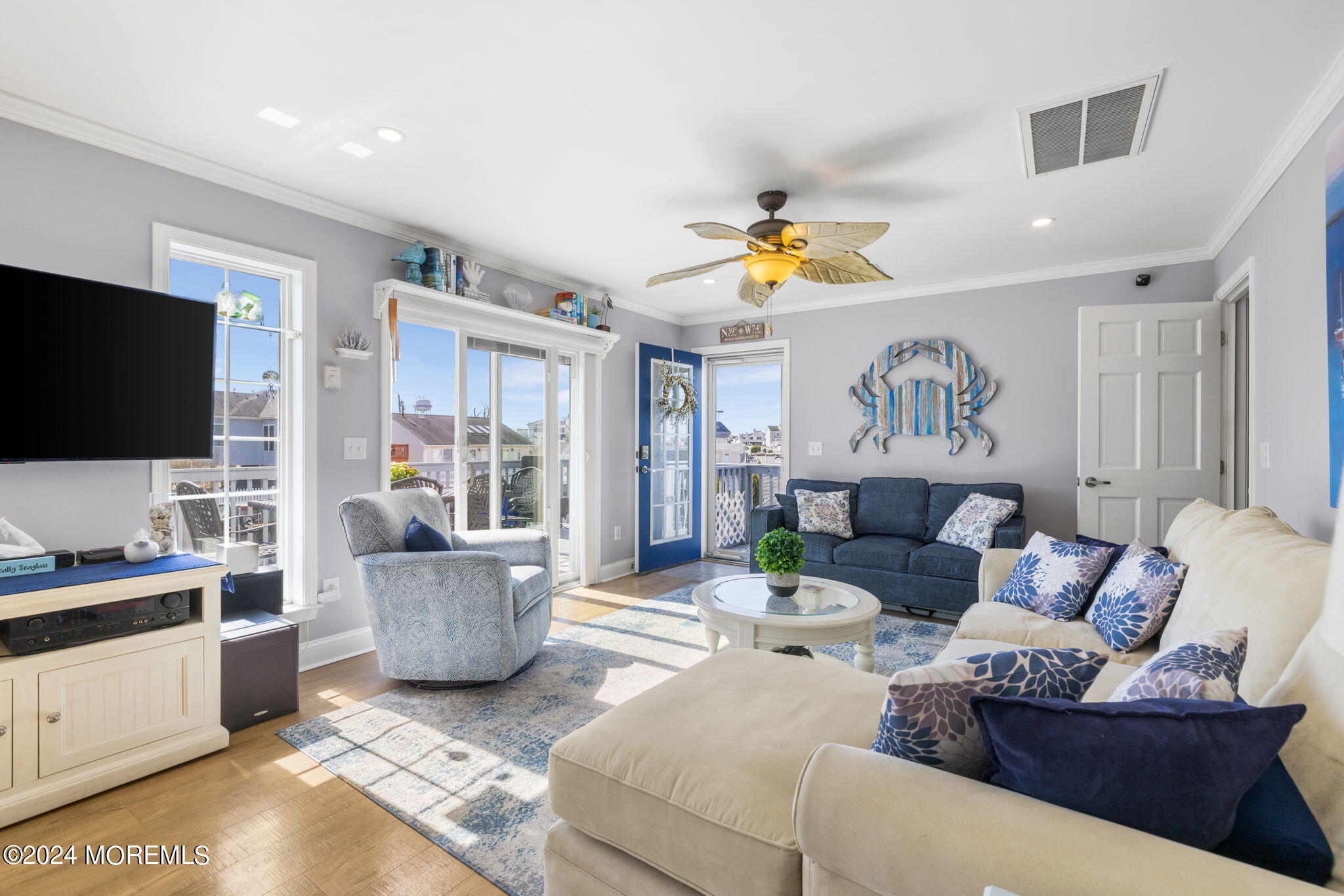 61 Rona Lane Beach Haven West, NJ 08050 - Photo 5 of 63 a living room with furniture and a flat screen tv