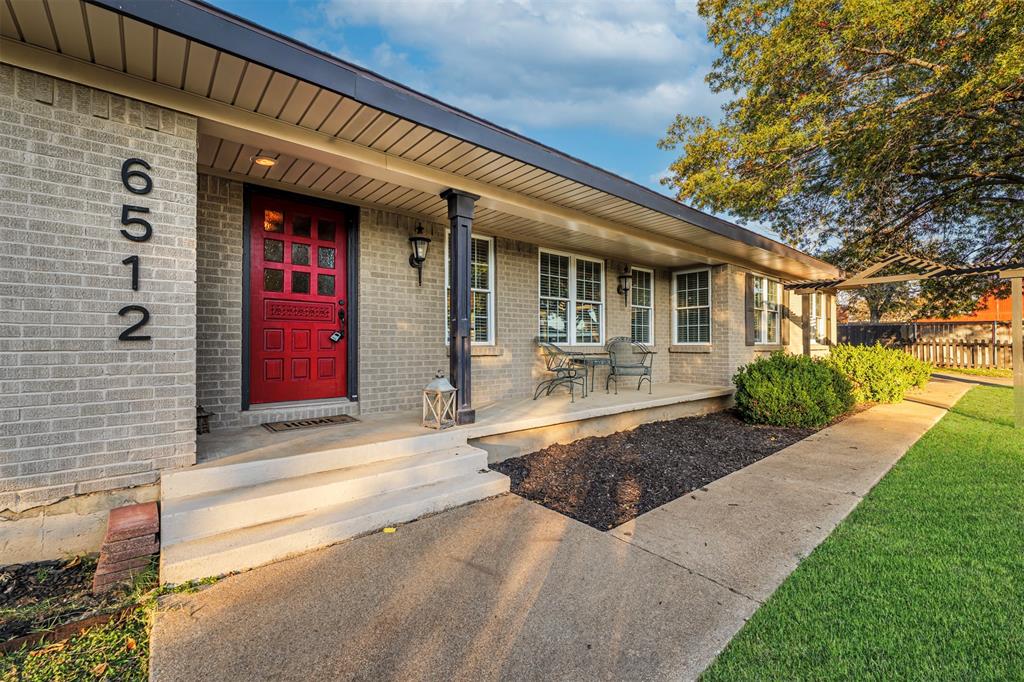 6512 Greenway Road Fort Worth, TX 76116 - Photo 1 of 38 Doorway to property featuring brick siding and a porch