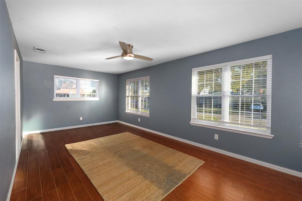 6512 Greenway Road Fort Worth, TX 76116 - Photo 14 of 38 Unfurnished room with dark wood-type flooring and a ceiling fan