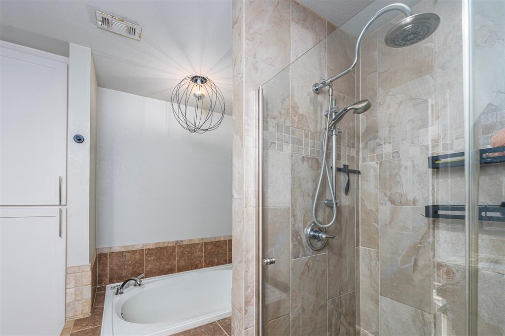 6512 Greenway Road Fort Worth, TX 76116 - Photo 17 of 38 Bathroom with a bath and a shower stall