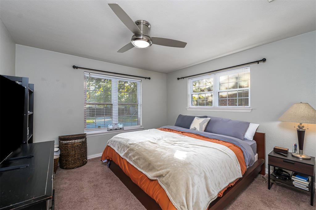 6512 Greenway Road Fort Worth, TX 76116 - Photo 22 of 38 Carpeted bedroom with a ceiling fan and multiple windows