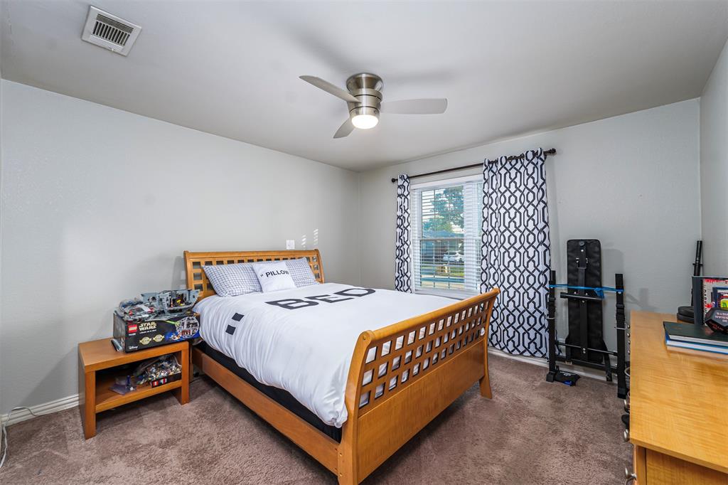 6512 Greenway Road Fort Worth, TX 76116 - Photo 23 of 38 Carpeted bedroom with ceiling fan and baseboards