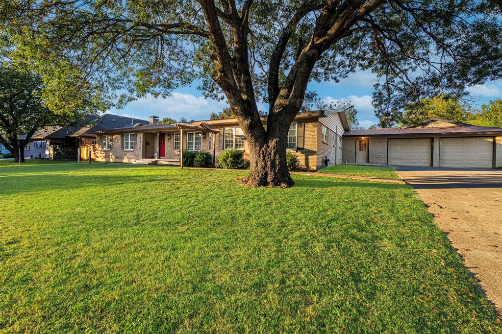 6512 Greenway Road Fort Worth, TX 76116 - Photo 3 of 38 Ranch-style house with brick siding, a front lawn, concrete driveway, an attached garage, and covered porch
