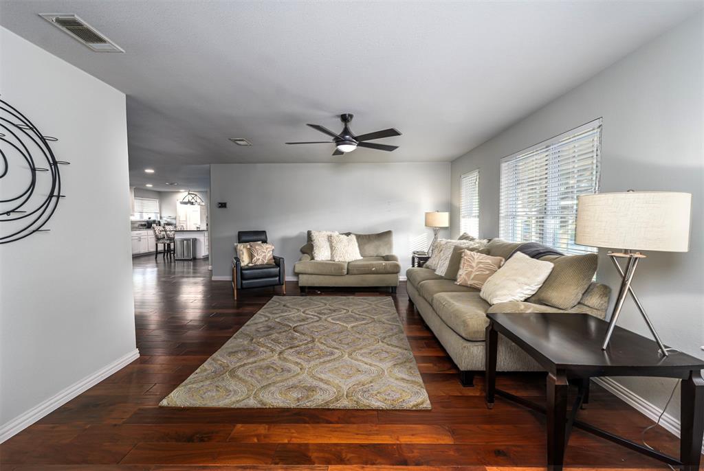 6512 Greenway Road Fort Worth, TX 76116 - Photo 5 of 38 Living area featuring plenty of natural light, dark wood-style floors, and a ceiling fan