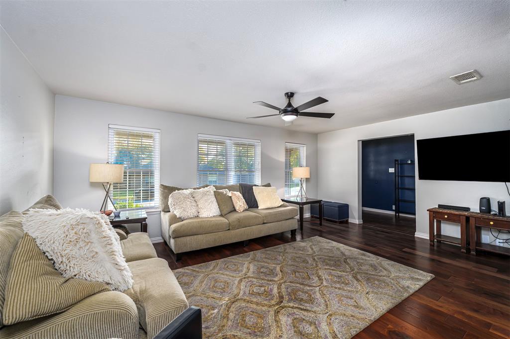 6512 Greenway Road Fort Worth, TX 76116 - Photo 7 of 38 Living room with dark wood finished floors, ceiling fan, and healthy amount of natural light