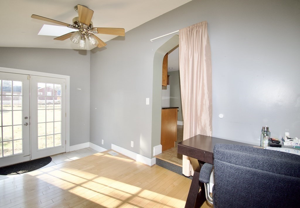 51 White Oak Road Springfield, MA 01128 - Photo 8 of 27 a bedroom with a bed and a chandelier