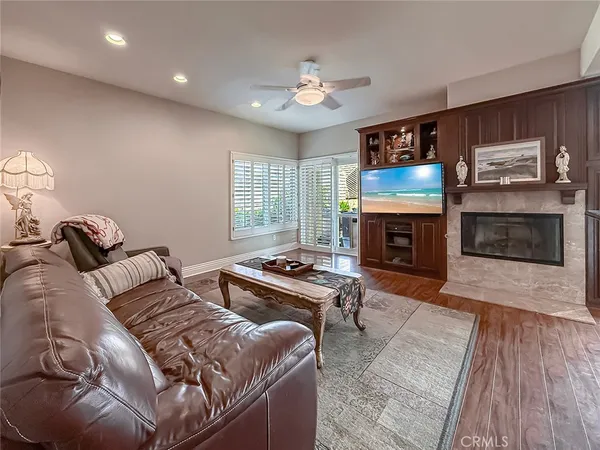 a living room with furniture and kitchen view