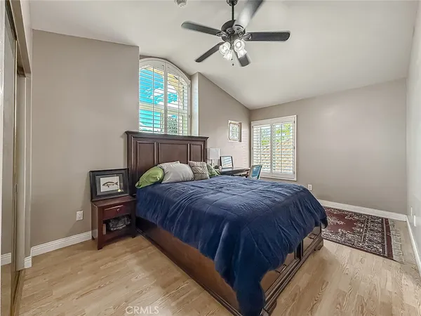 a living room with patio furniture and a fireplace