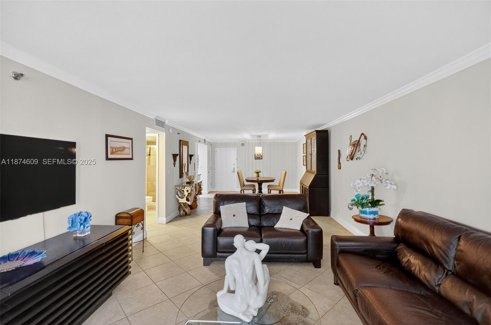 2401 Collins Avenue, Unit 1005 Miami Beach, FL 33140 - Photo 5 of 19 a living room with furniture and wooden floor