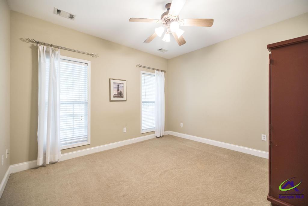 204 Smith Road Haddock, GA 31033 - Photo 26 of 51 an empty room with windows and fan