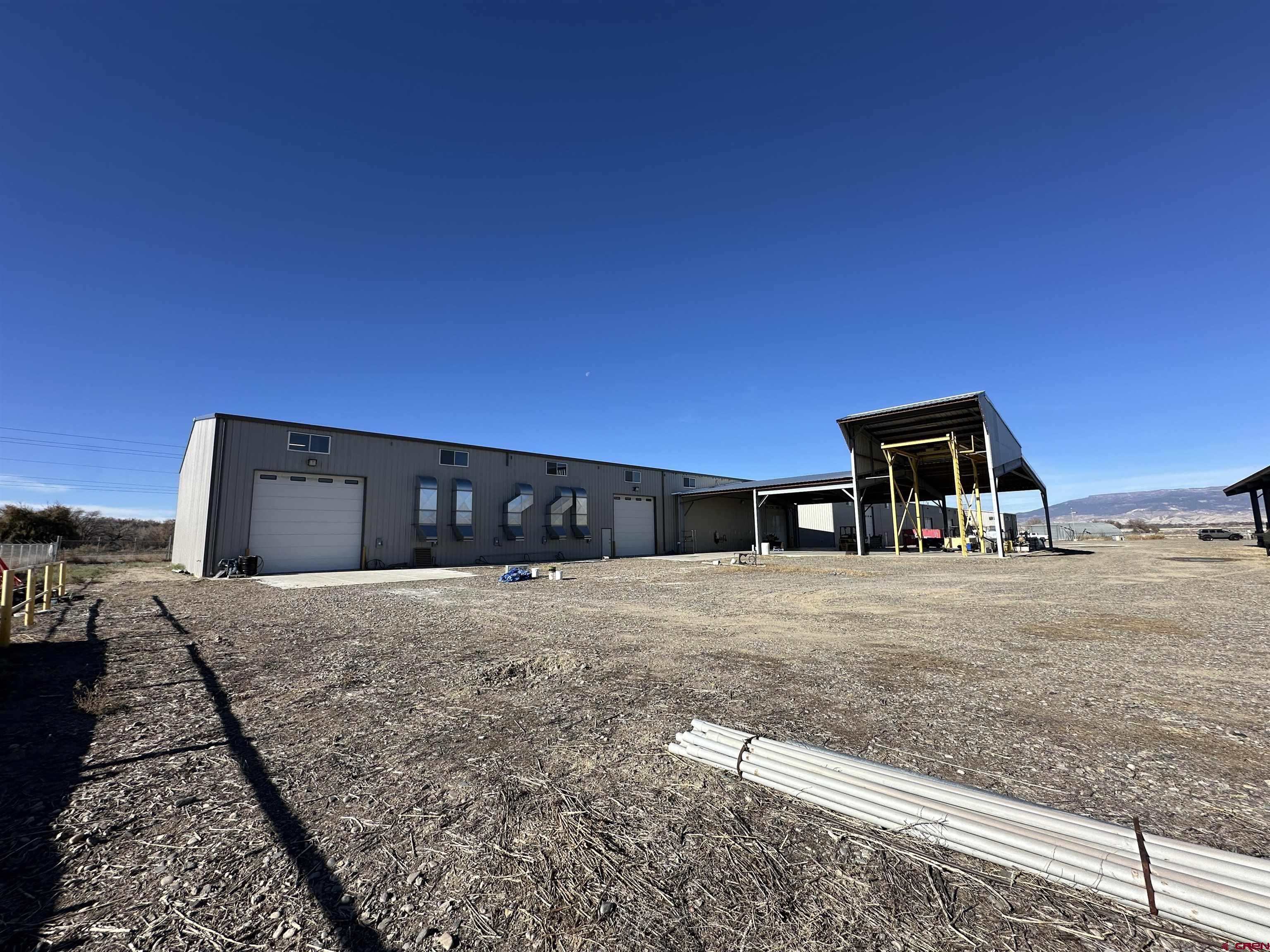 18668 B50 Road, Unit BUILDING B & C Delta, CO 81416 - Photo 1 of 17 a house view with a backyard space