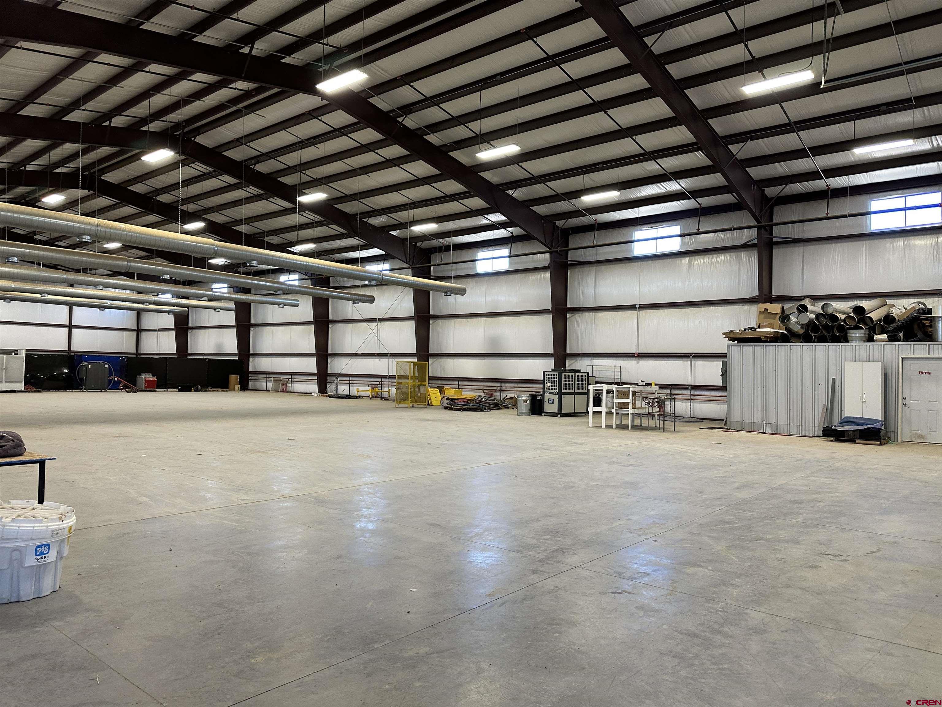 18668 B50 Road, Unit BUILDING B & C Delta, CO 81416 - Photo 2 of 17 a view of a empty room with wooden ceiling