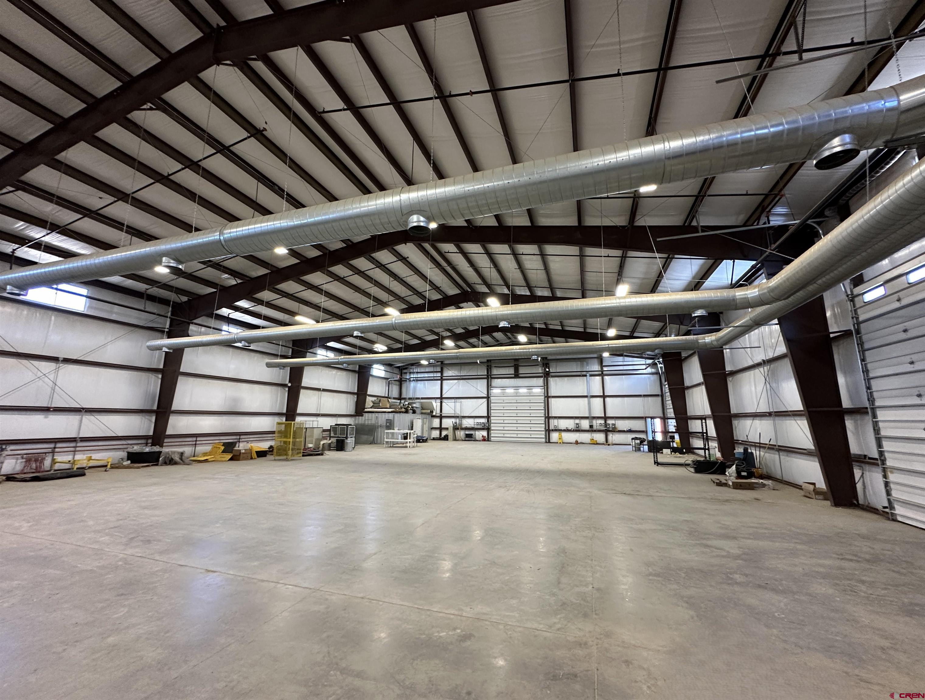 18668 B50 Road, Unit BUILDING B & C Delta, CO 81416 - Photo 5 of 17 a view of an empty room with gym equipment