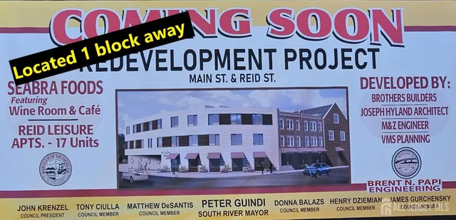 a view of a lake with a house in the background