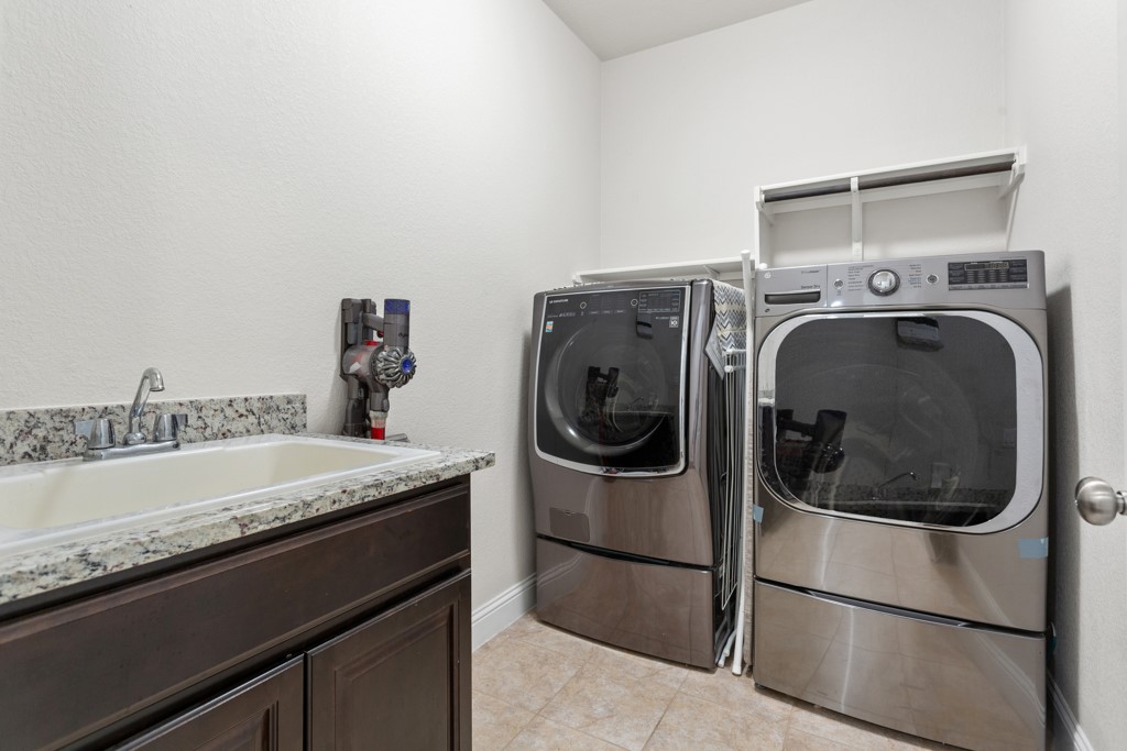1916 Elaina Loop Leander, TX 78641 - Photo 18 of 23 a utility room with dryer and washer