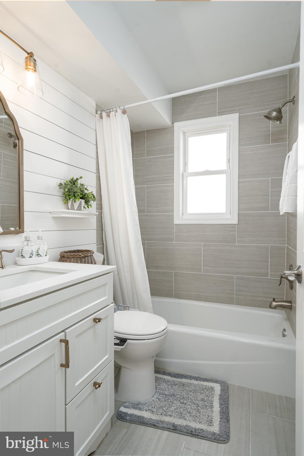 6401 Winnepeg Road Bethesda, MD 20817 - Photo 16 of 41 a bathroom with a sink a toilet and a bathtub