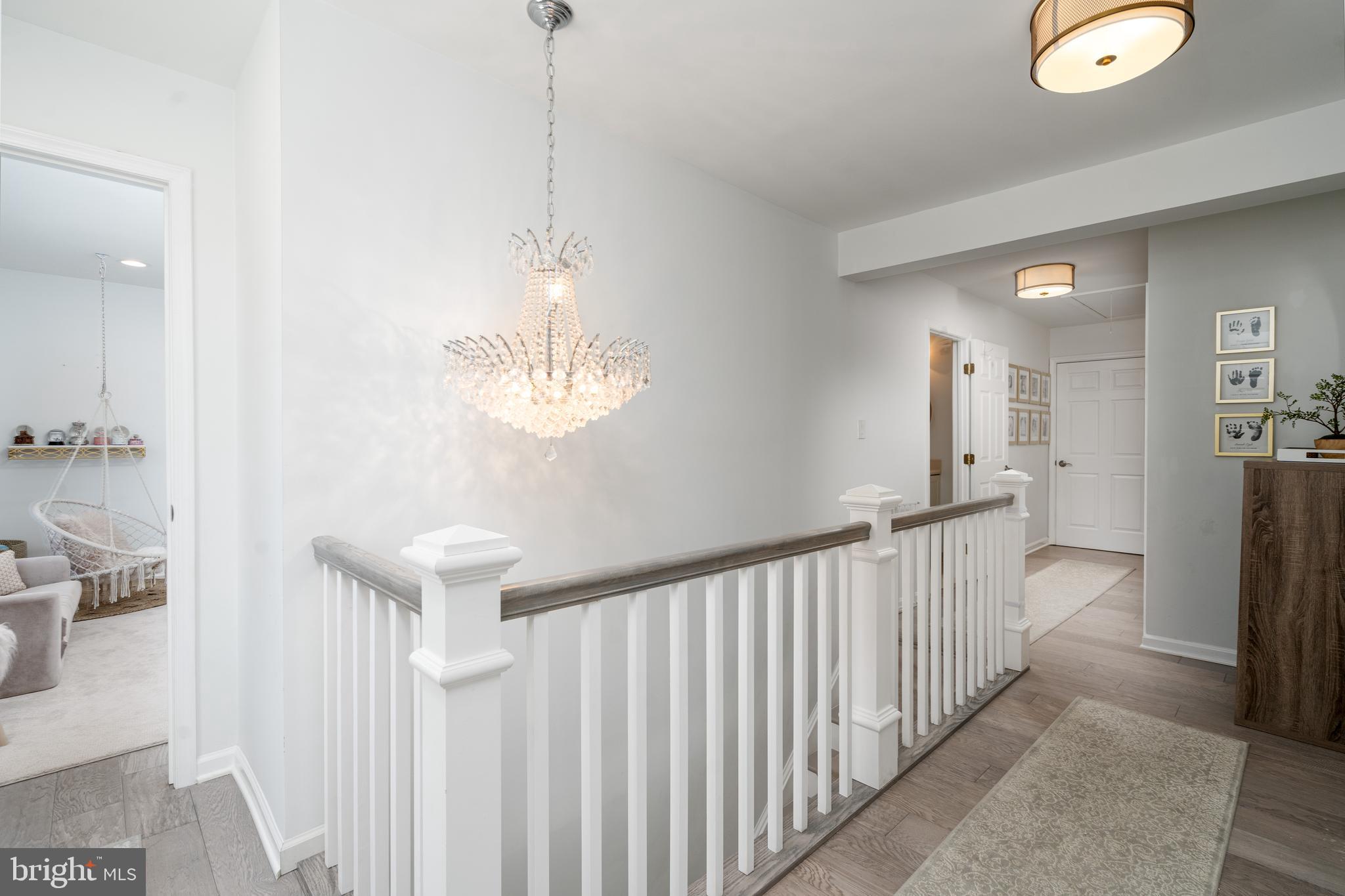 6401 Winnepeg Road Bethesda, MD 20817 - Photo 19 of 41 a view of a hallway with a chandelier