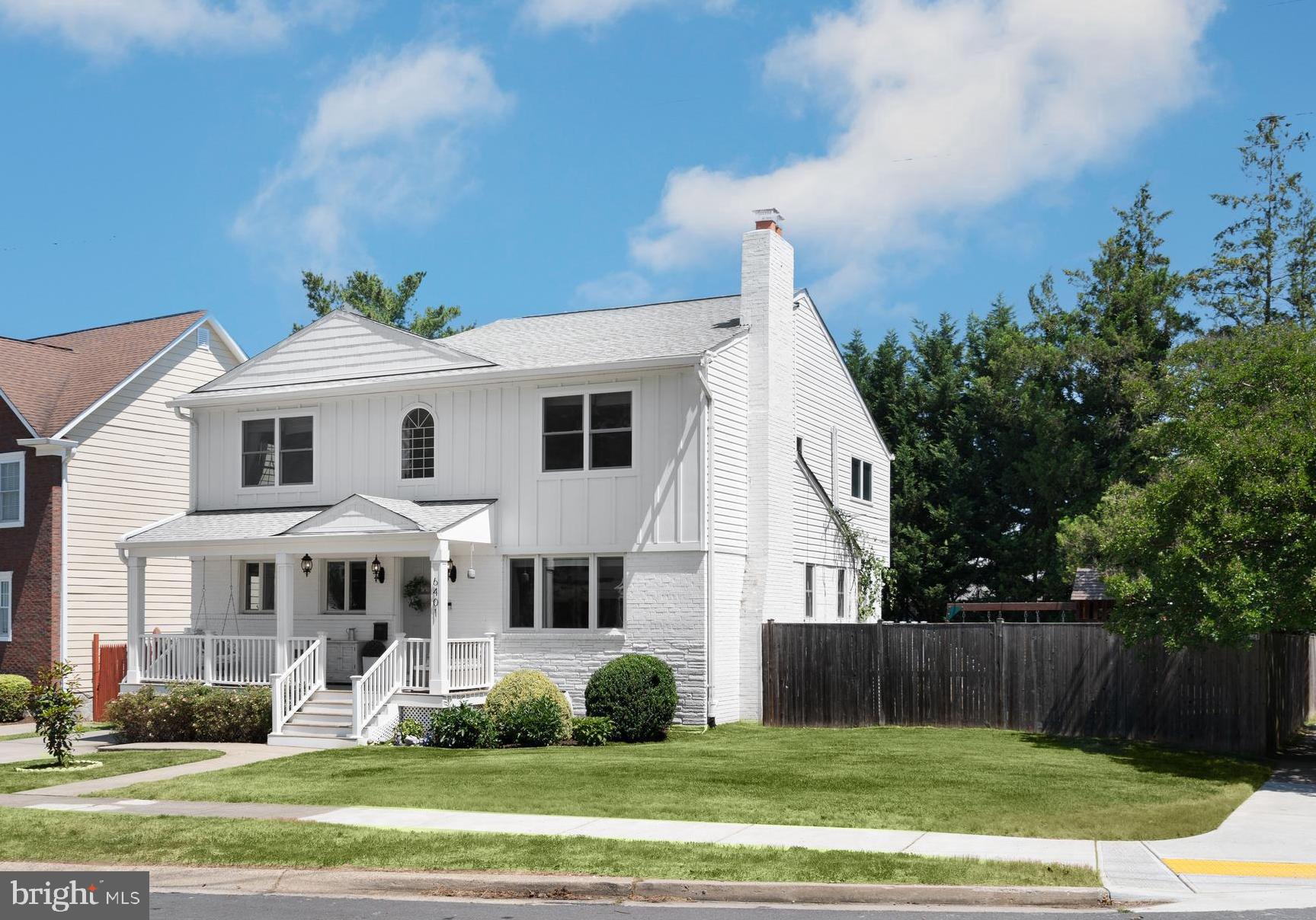 6401 Winnepeg Road Bethesda, MD 20817 - Photo 2 of 41 a front view of a house with a yard