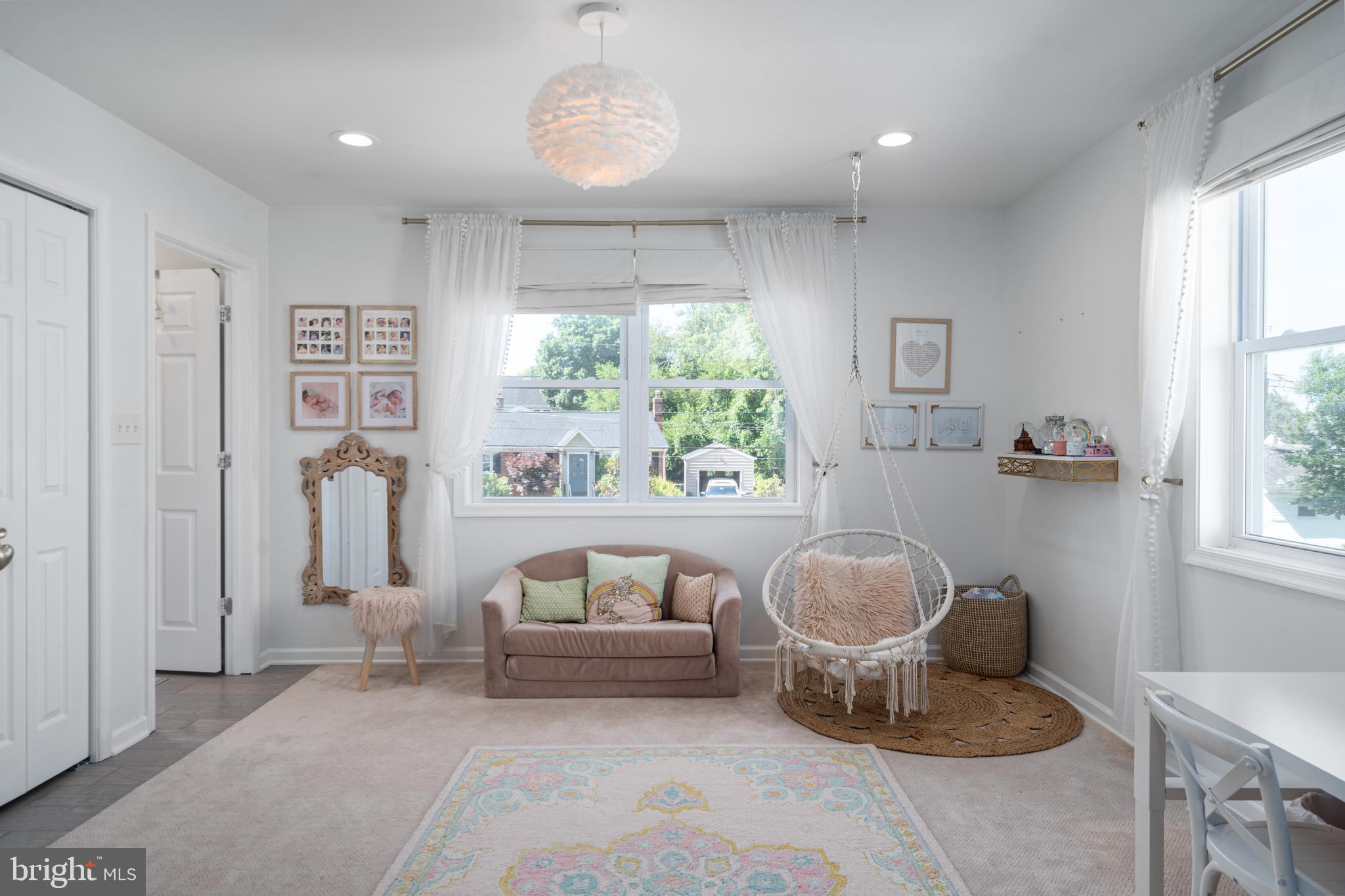 6401 Winnepeg Road Bethesda, MD 20817 - Photo 22 of 41 a living room with furniture and a large window